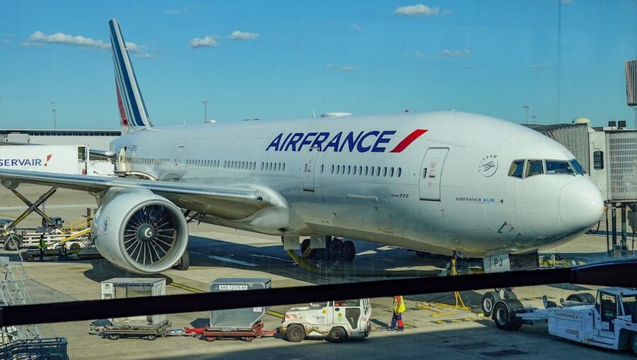 Air France airplane parked on the tarmac under a clear blue sky