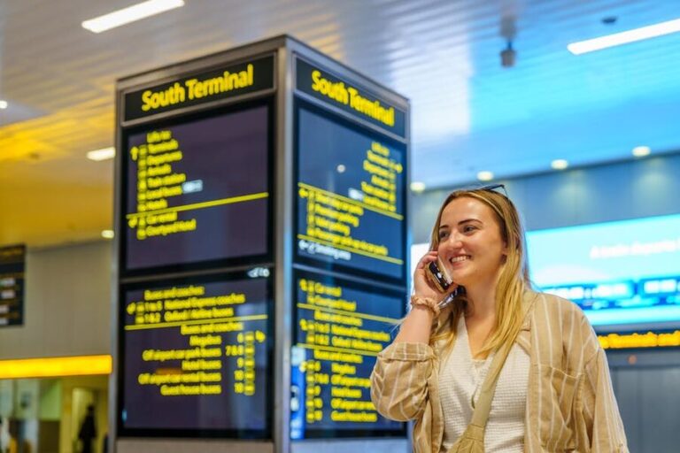 Woman calling British Airways from Gatwick Airport terminal