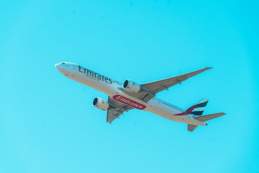 Emirates Boeing 777 against a clear blue sky