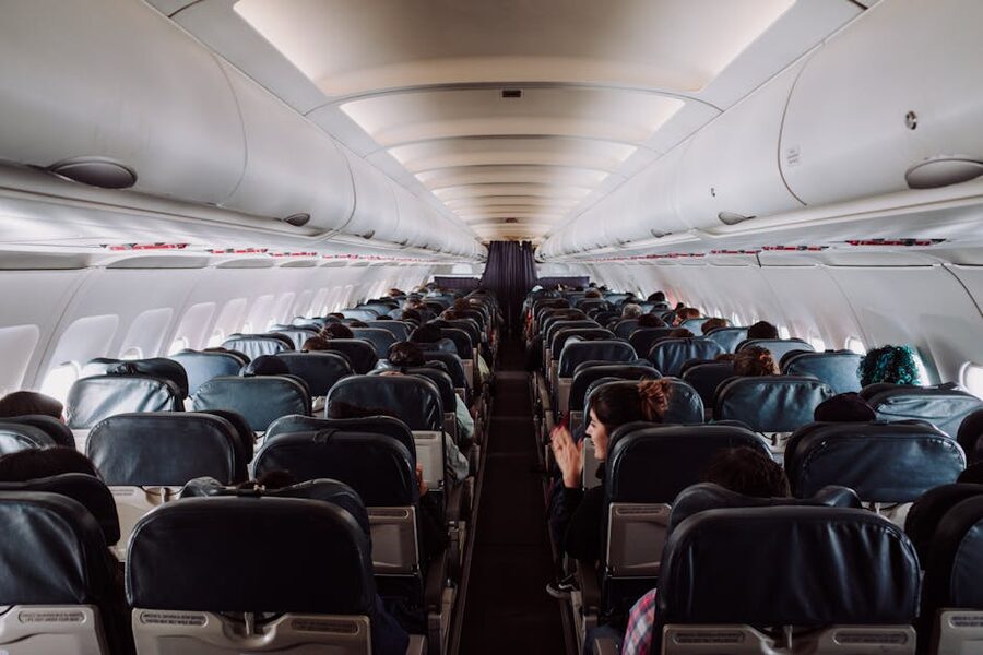 Passengers in a commercial airplane cabin during flight