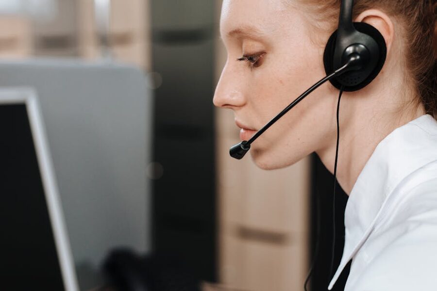 Customer service representative on headset working through a call