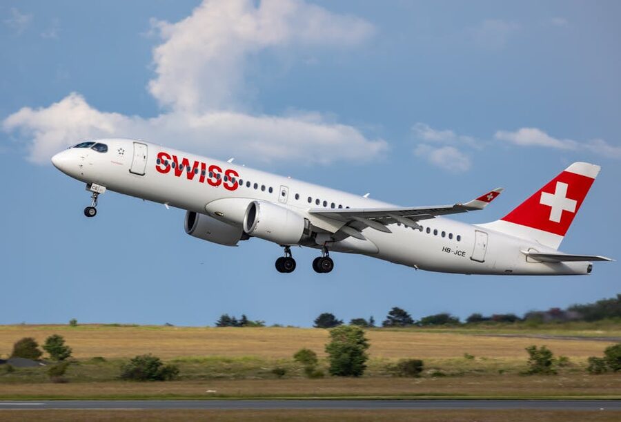 Swiss International Air Lines Airbus A220 taking off under clear skies