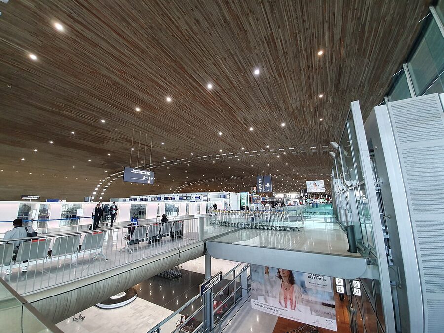 Interior of Terminal 2E at Paris Charles de Gaulle Airport with boarding gates and passenger seating