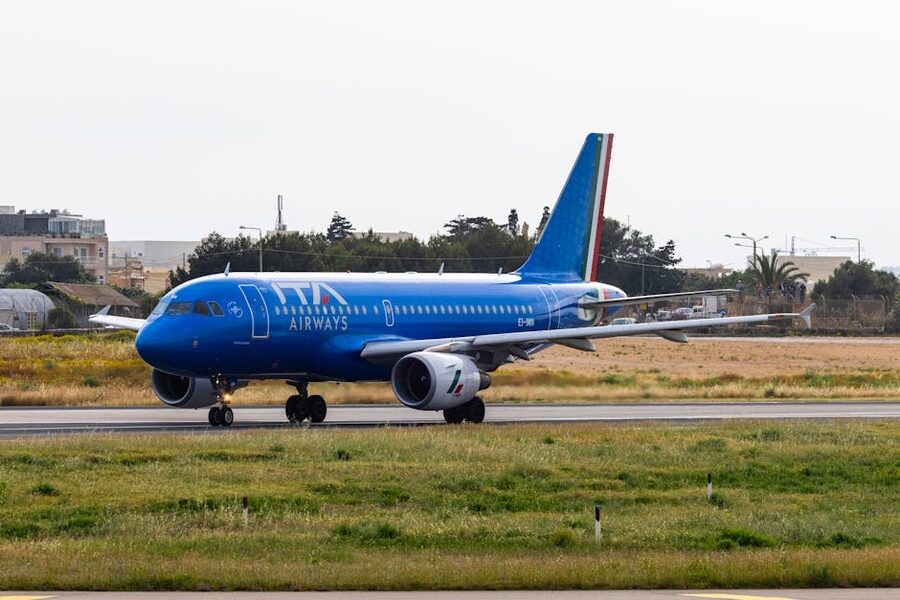 ITA Airways Airbus on runway preparing for takeoff