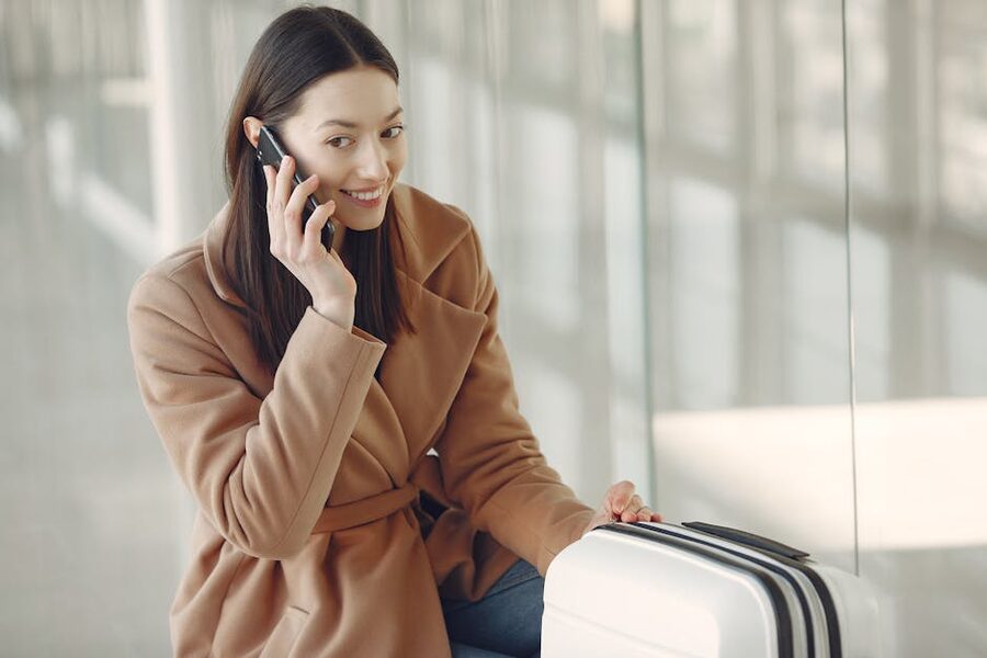 Traveler on a phone call in an airport terminal