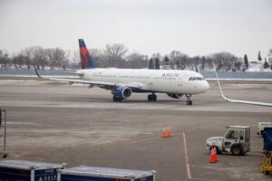 Delta aircraft at snowy airport