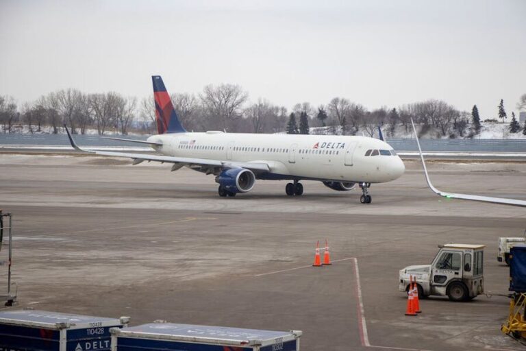 Delta aircraft at snowy airport