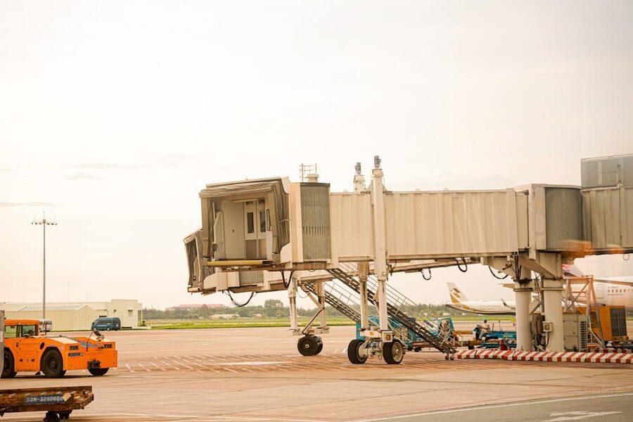 Airport jet bridge connecting terminal to aircraft on the apron