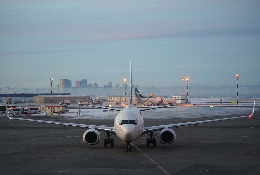 WestJet 737 with Calgary skyline